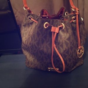 Michael Kors logo over the shoulder bucket bag