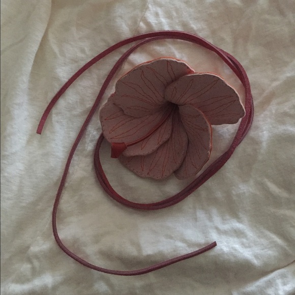 Leather flower pin.