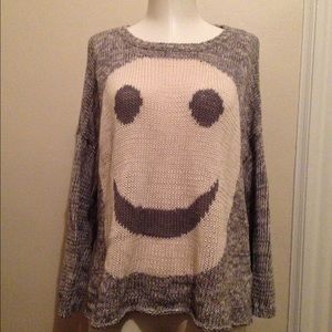 Smiley face sweater with open back