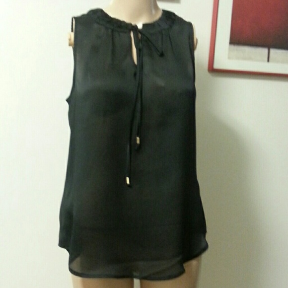 NY&C Sheer black sleeveless blouse.