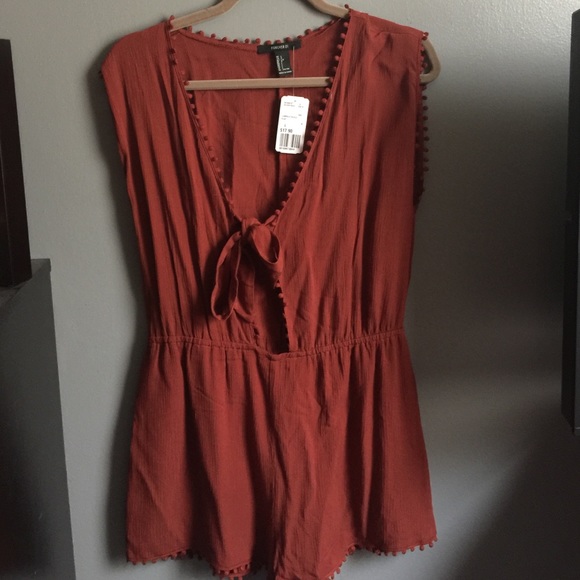 NWT romper with Pom Pom detailing