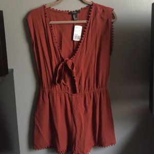 NWT romper with Pom Pom detailing