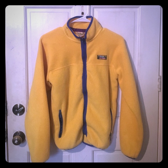 Yellow zip-up fleece. Blue zippers.