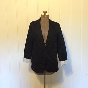 Work blazer with detailed cuffs.