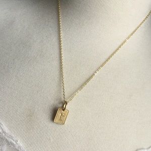 Dainty "r" initial gold plated chain and charm.