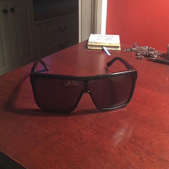 Spy Flynn's Black frames, black lenses.