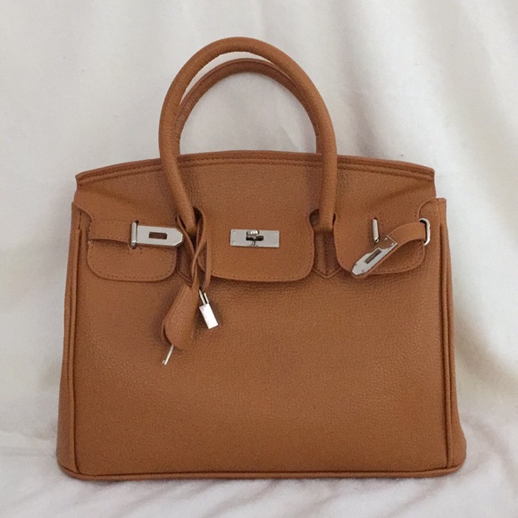 👜