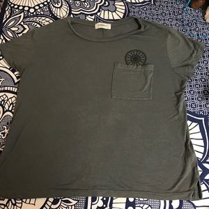 Grey soul cycle t shirt with flywheel over pocket