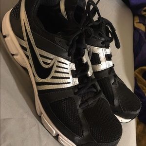 Nike silver and black running shoes, men's size  9
