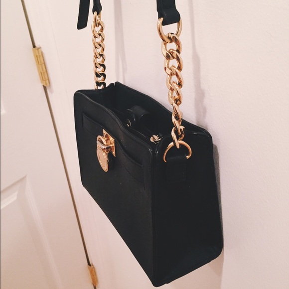 Very versatile Michael Kors crossbody purse.