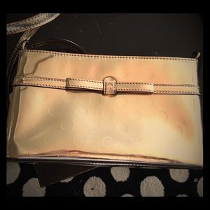 Gently used auth Kate Spade crossbody gold bag