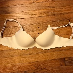 Ivory push up bra with leopard print on the inside
