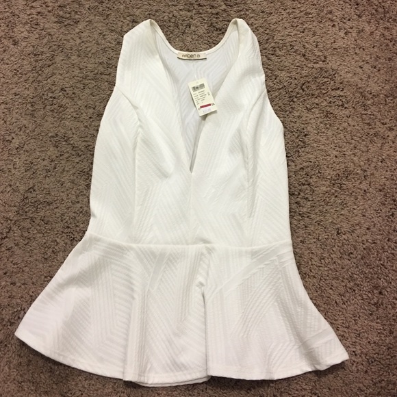 Never worn. White peplum Shirt