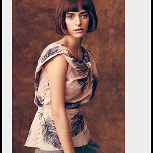 On a wing blouse by Byron Lars