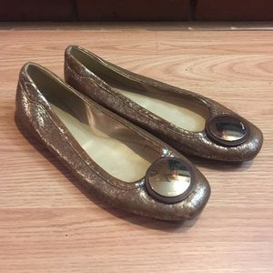 Hogan gold ballet flats with gold button accent