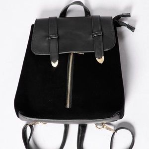 Black velvet/leather backpack with gold detailing