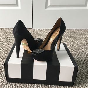 Black L.A.M.B satin pumps