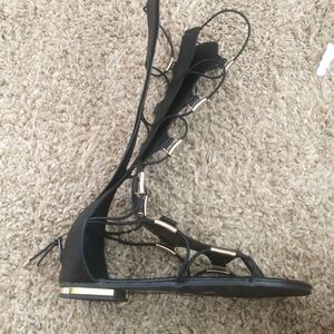 Black and gold gladiator sandals