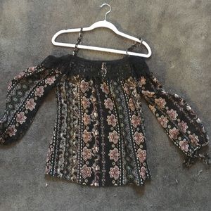 An off the shoulder printed shirt