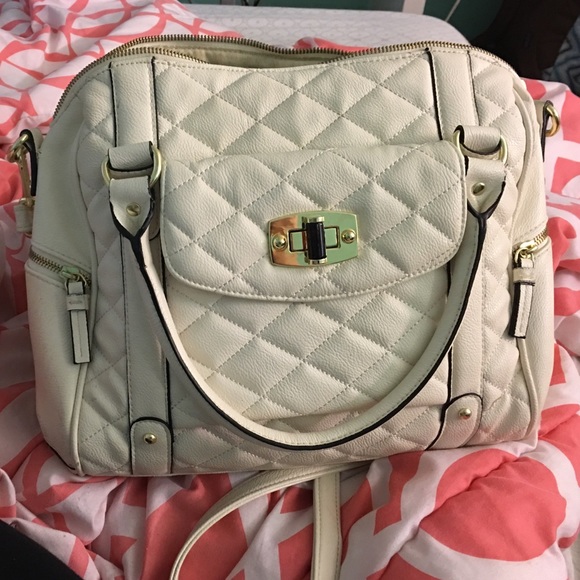 White satchel purse. Comes with a strap