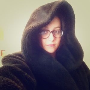 Floor length dark brown fur coat with hood