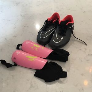 Girls cleats and shin-guards for soccer.
