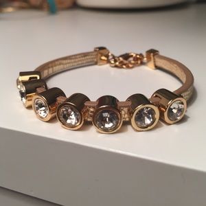 Rhinestone and gold print juicy couture bracelet