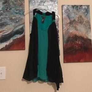 Green/Black tank top.
