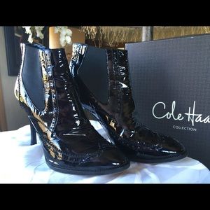 High fashion Black patent leather booties.