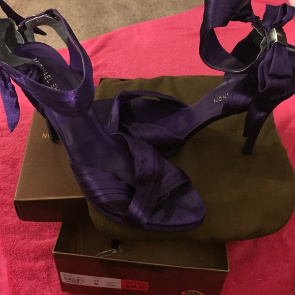 Purple heels with ankle bow. size 11, worn once!