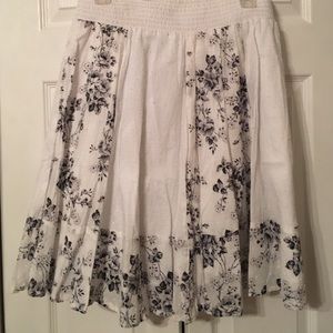 White skirt with black floral design.