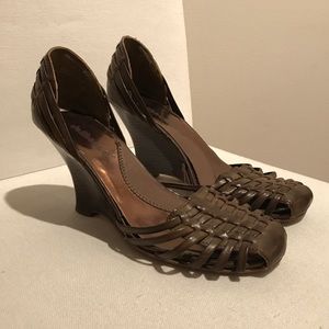 Wooden wedges with woven wicker like top.