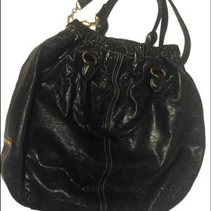 Authentic MiuMiu leather bag with gold hardware.