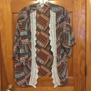 White lace, orange and blue cardigan.