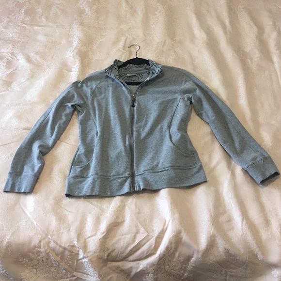 Grey zip up sweatshirt.