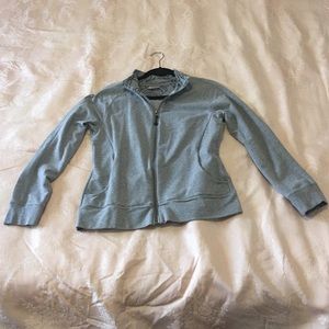 Grey zip up sweatshirt.