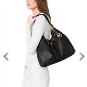 Sold.   New Authentic Michael kors black leather