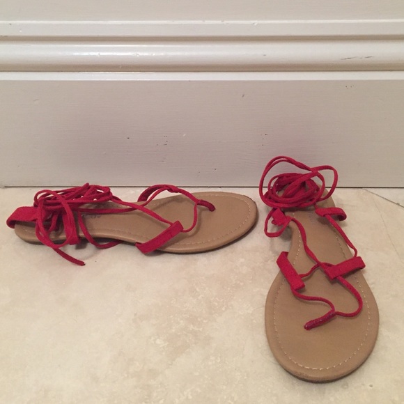Strappy red flat sandals