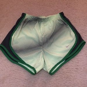 Black and Green patterned Nike running shorts