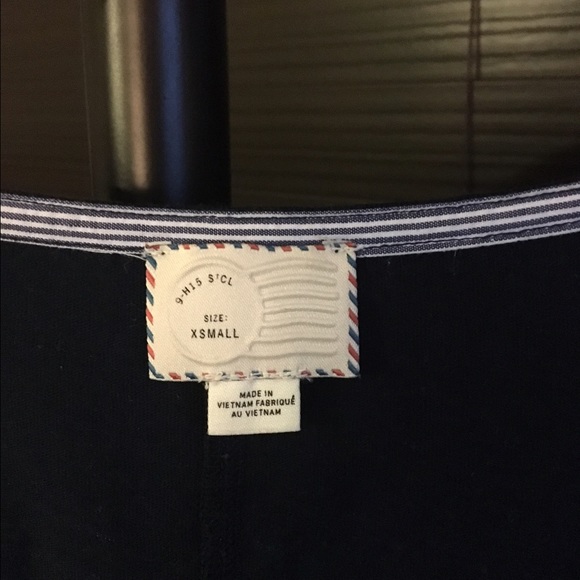 Navy shirt with striped detail near the buttons. - Picture 2 of 2