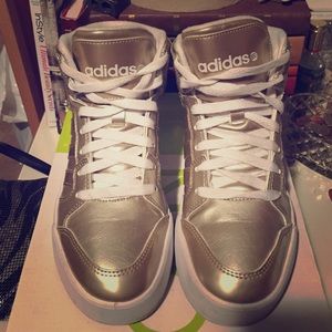 Gold high top Adidas sneakers