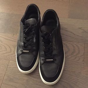 Burberry leather black and white bottom sneakers.