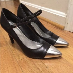 Black Tahari pumps with silver toe.