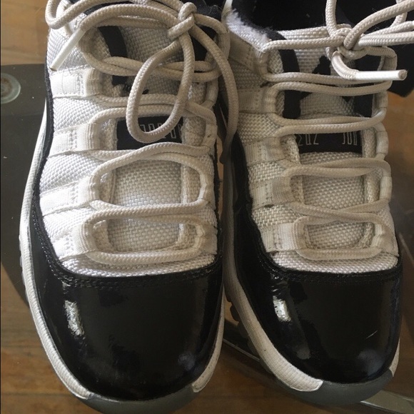 White & black low top 11's