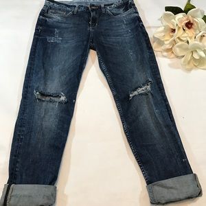 Distressed boyfriend jeans.