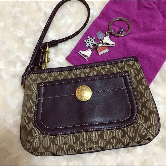 Coach Wristlet w Signature Fabric and Plum detail