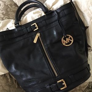 Michael Kors bucket style handbag. Black w/gold