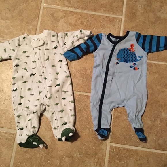 2 newborn Carter's outfits.