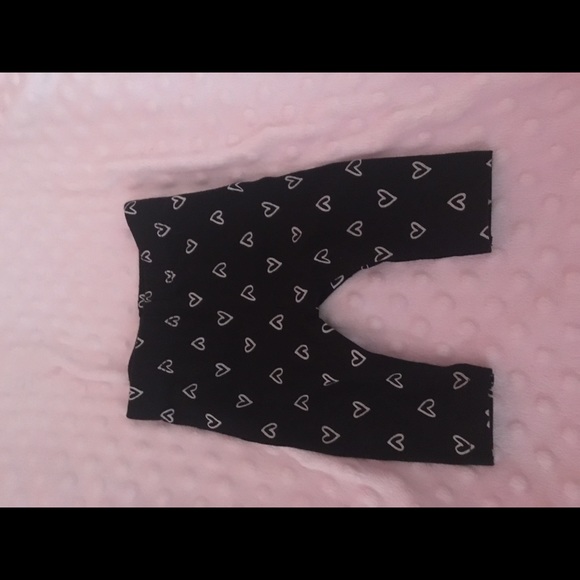 Black Pants with White Hearts.