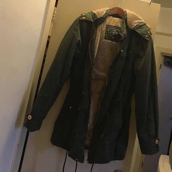 Green parka with fur inside